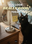 Typography on deep blue: “You look really good today” with a small black cat illustration.