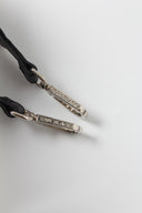 Detachable genuine leather strap with metallic clips detail close-up 