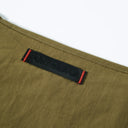 Olive Off Duty Puff Toby Bag with red leather straps and studs