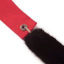 "Detail of black faux fur strap ends showing Toby Black engraved metal hardware"