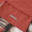 Interior detail of Fortune Jockey Toby Bag showing Toby Black metal logo plate and premium stitching