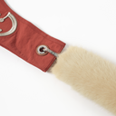 Close-up of detachable faux fur handle with metal hardware and Toby Black engraved clasp