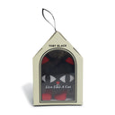 Packaged product with 'Toby Black' branding and a cat-themed design.