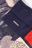 Interior pocket detail with Toby Black metal label on navy fabric lining