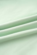 Close-up of green hoodie fabric texture detail