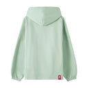 Green oversized hoodie back view with red cat logo tag