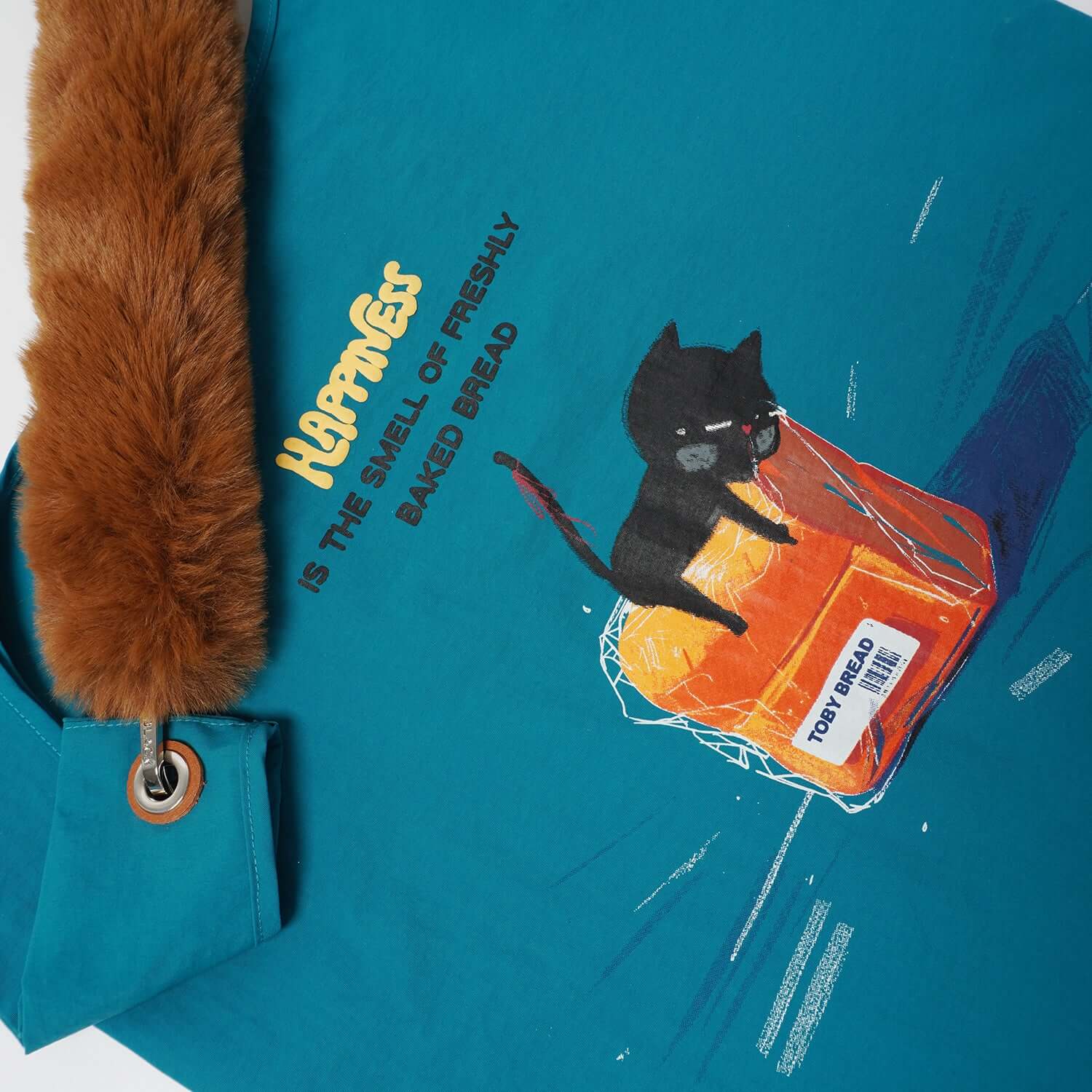 Close-up front view highlighting the playful toby cat themed graphic