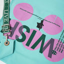 Close-up of WISH typography and black cat illustration on mint tote bag