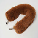 Detachable brown faux fur strap with silver hardware on white background