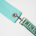 Metal eyelet with leather detail on Toby Black Wish Bag strap attachment