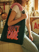 "I DON'T CARE" Toby Bag with detachable faux fur strap